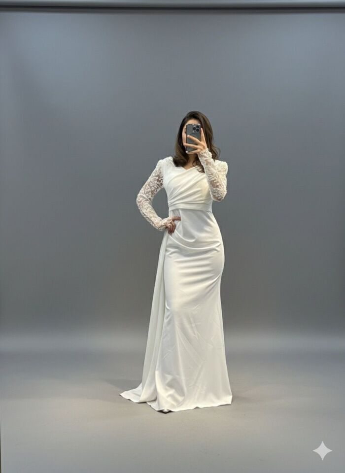 Elbise, pürüzsüz ve dökümlü kumaşın dantel kollarla birleşimi sayesinde klasik ve modern unsurları bir araya getiriyor. Drape ve asimetrik panel detayı, elbiseyi özel günler için sofistike ve göz alıcı bir seçenek haline getiriyor.(ME1011BY)